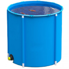 Blue 700 litre koi carp holding tank with outlet, filled with water and koi