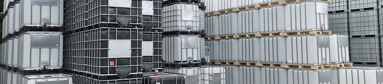 White and black IBC Tanks stacked